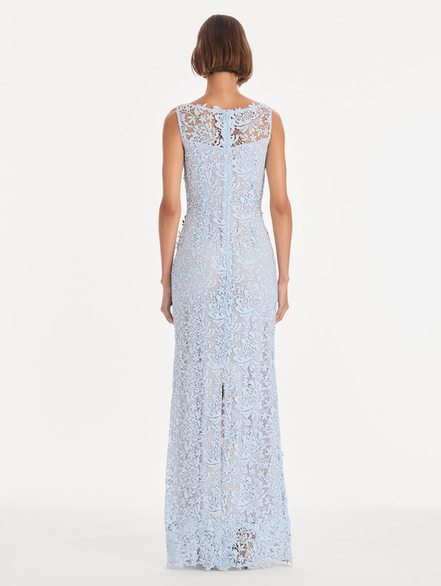 The model is wearing a sleeveless chrysanthemum guipure embroidered gown. Back view.