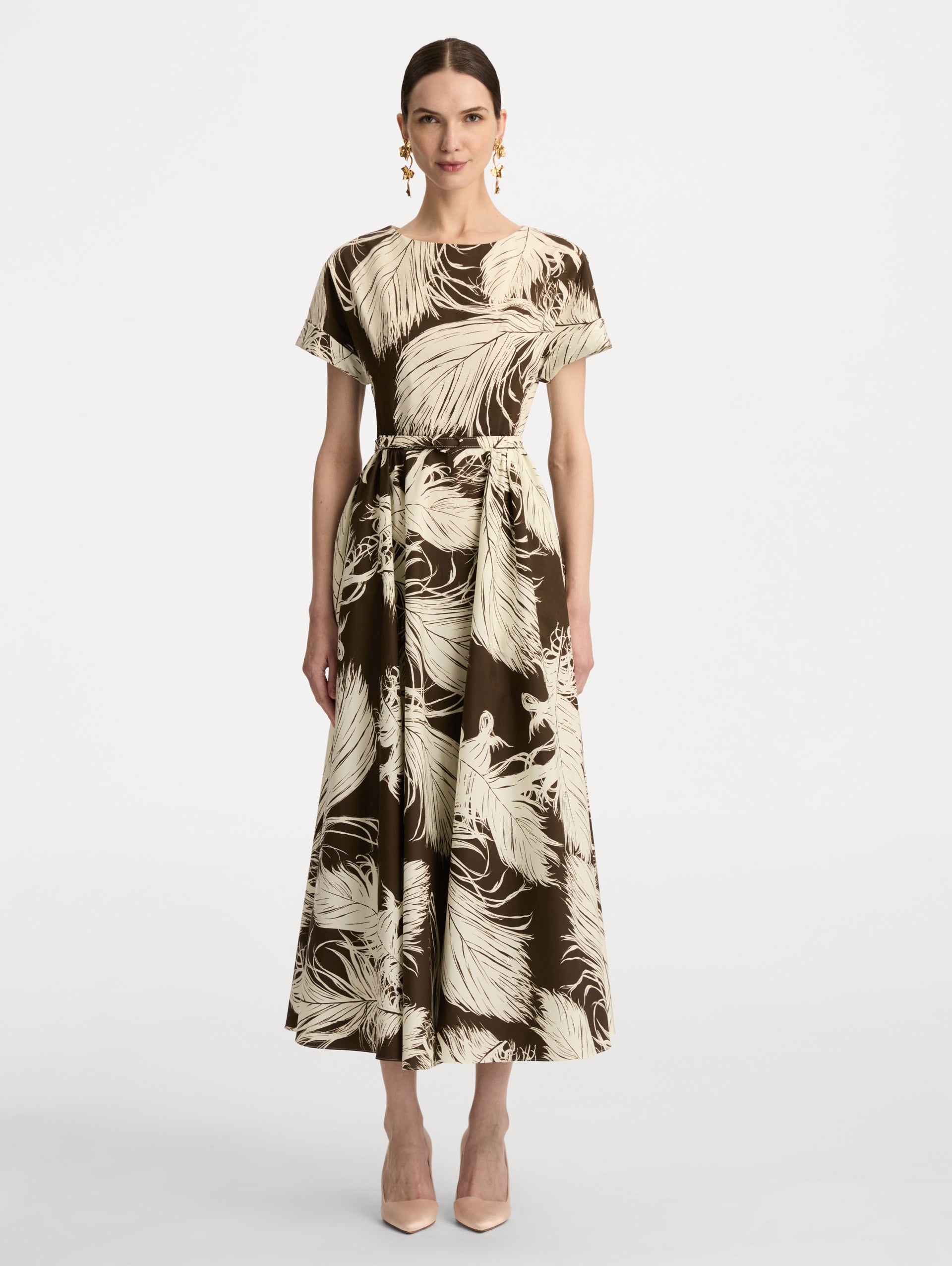 Ivory and Brown Feather Cotton Poplin Dress with short sleeves, fitted waist, and full skirt, featuring bold feather print throughout. Front View.