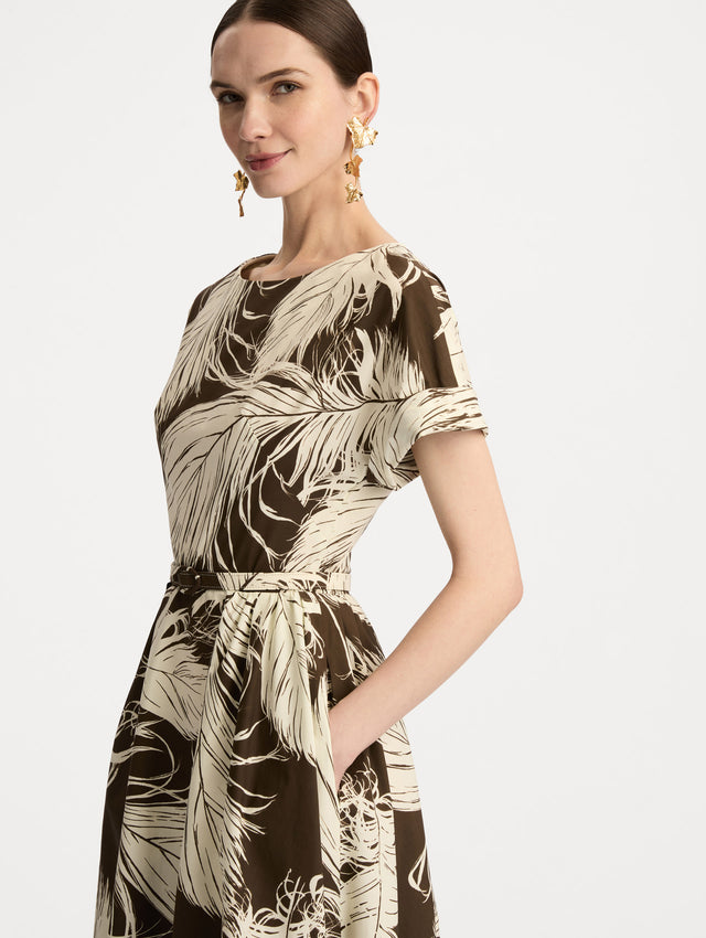 Ivory and Brown Feather Cotton Poplin Dress with short sleeves, fitted waist, and full skirt, featuring bold feather print throughout. Zoom View.