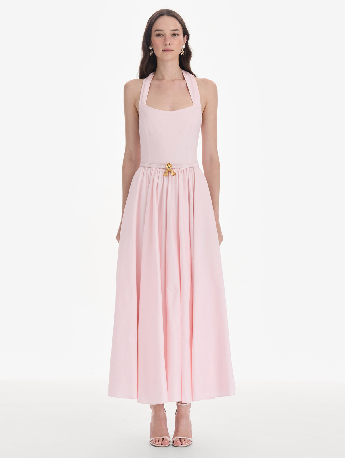 The model is wearing a sleeveless stretch cotton poplin sateen day dress. Front view.