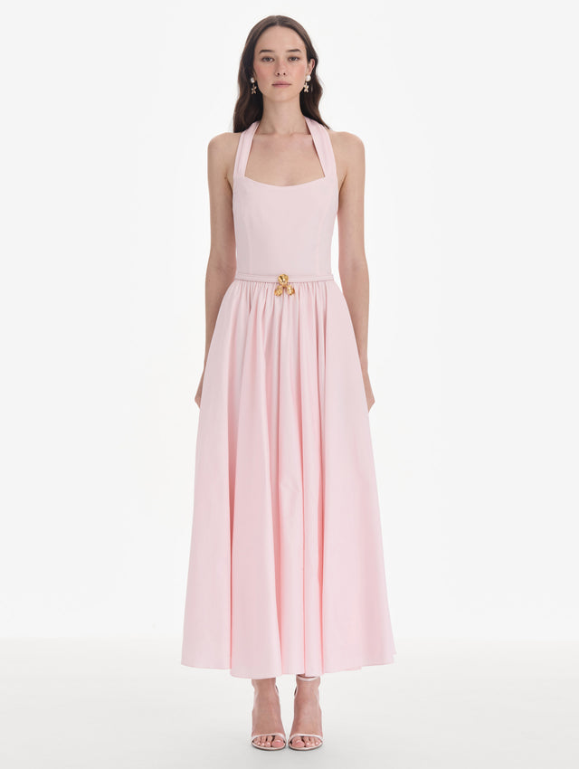 The model is wearing a sleeveless stretch cotton poplin sateen day dress. Front view.