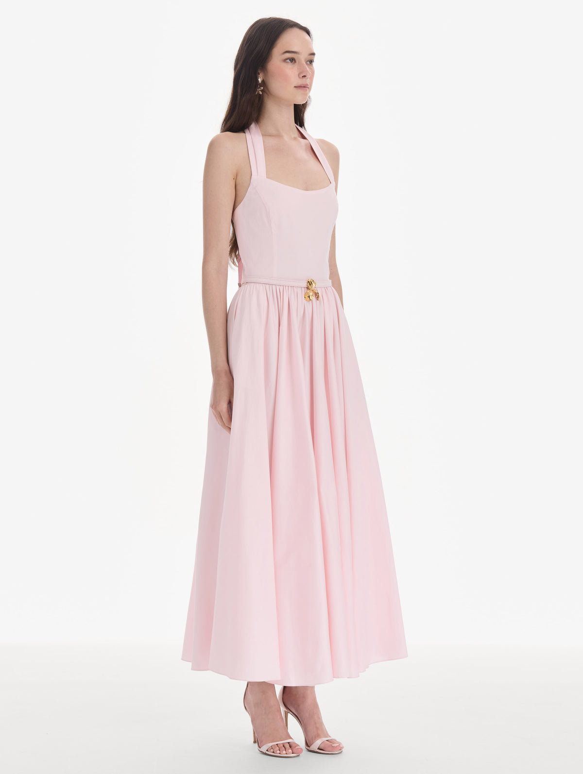 The model is wearing a sleeveless stretch cotton poplin sateen day dress. Back view.