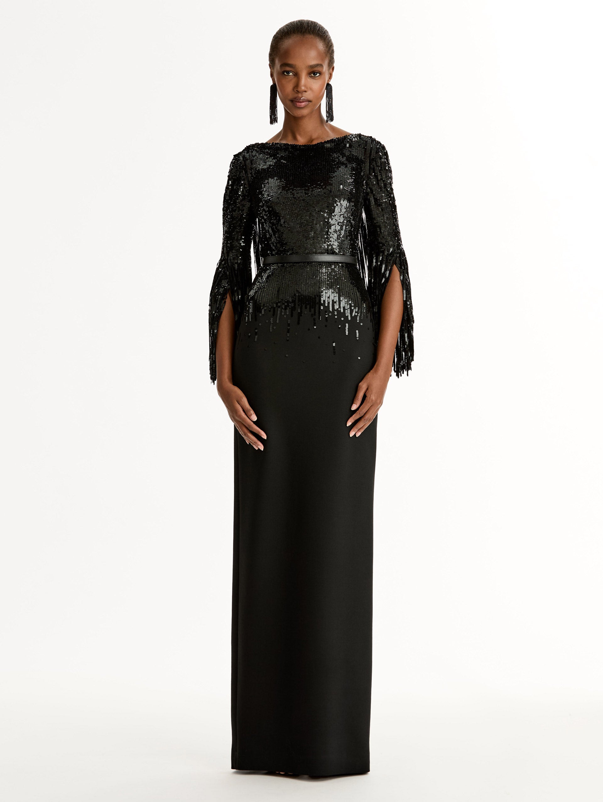 Black Sequin, Floor length gown in double-faced stretch wool. Open sleeves with beaded fringe. Front View.