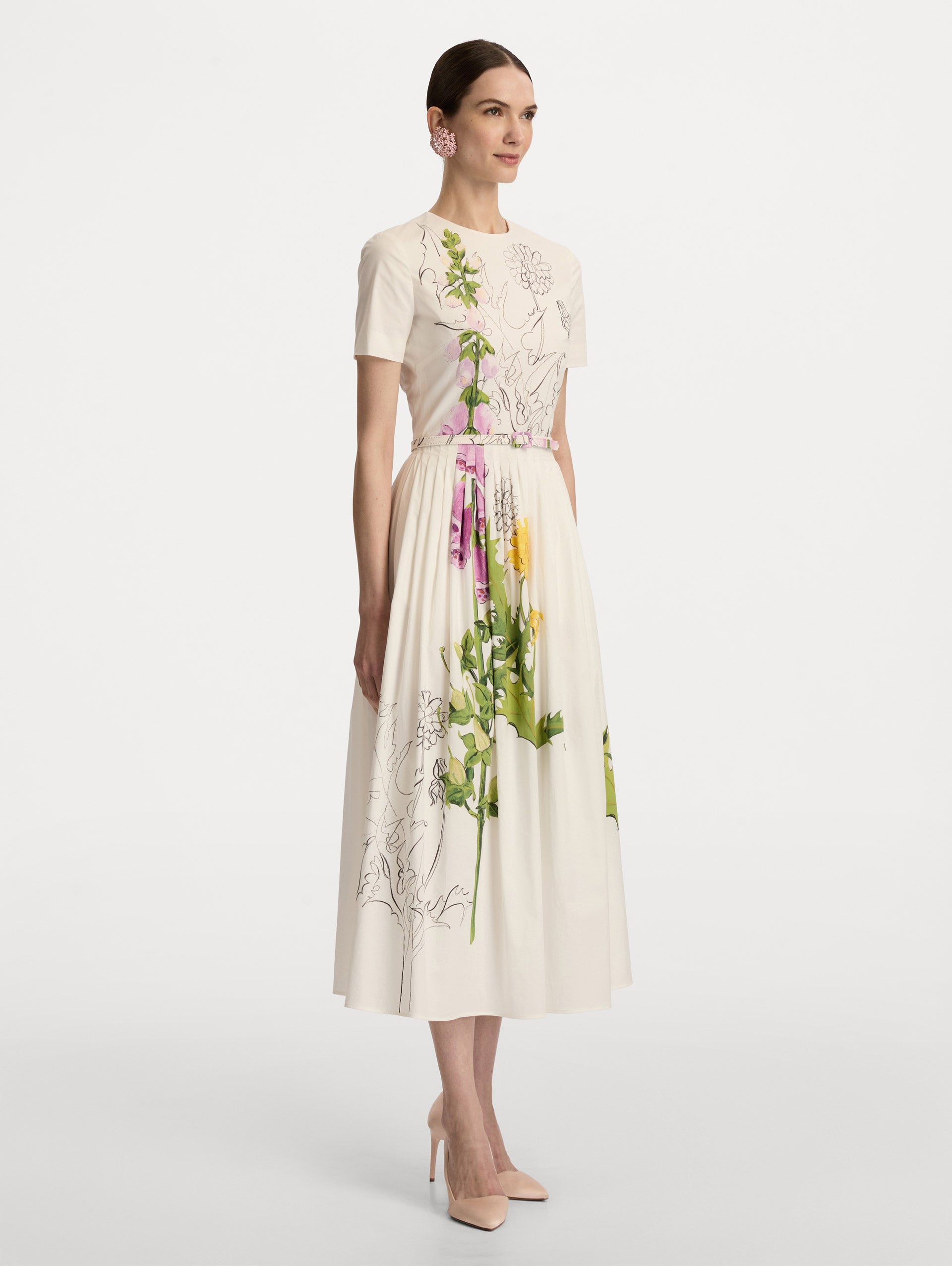 White Foxglove Sketch Cotton Poplin Dress featuring colorful flowers and black sketch-style outlines, fitted waist, and a full skirt. Side View.