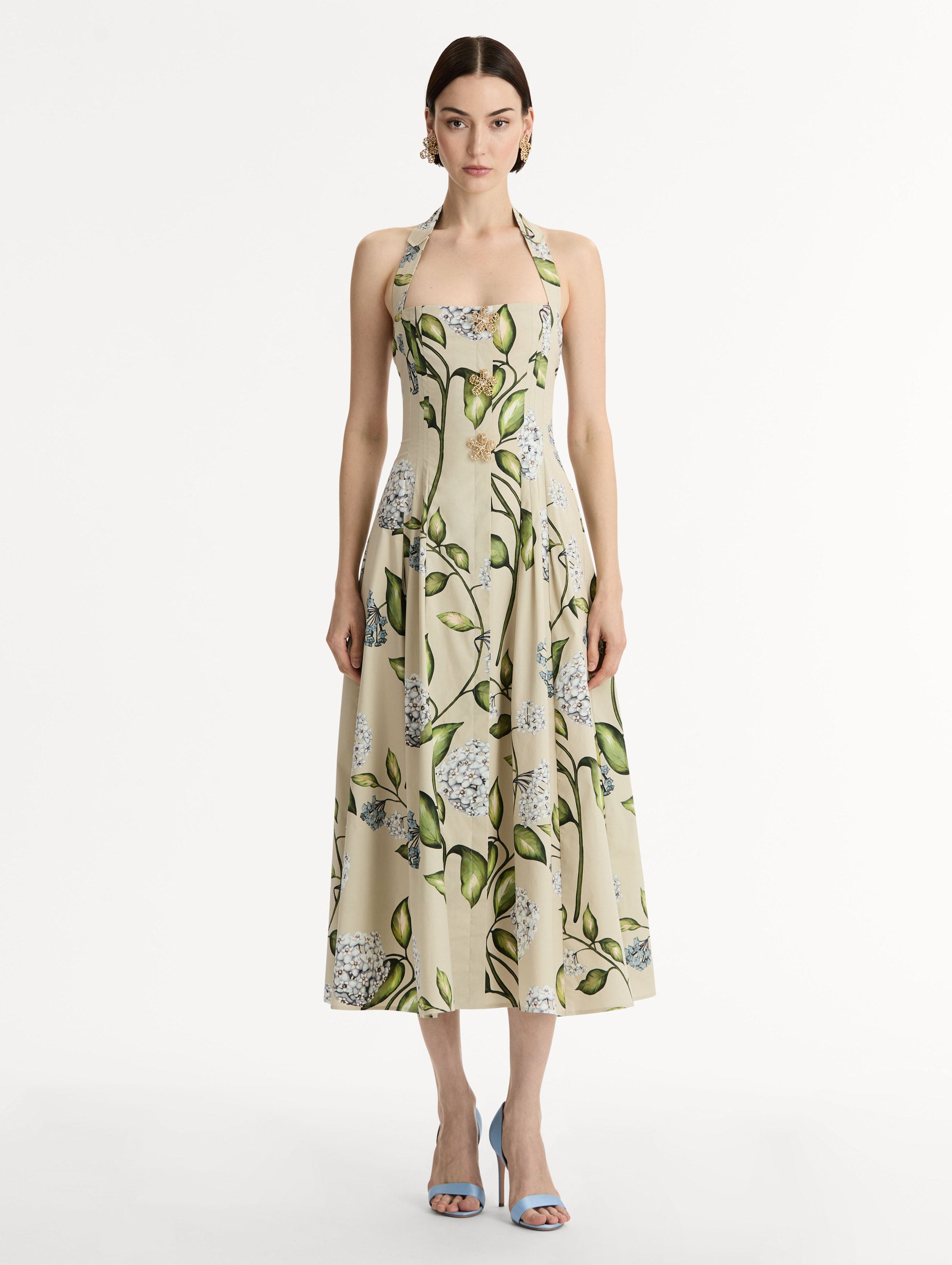 Cotton Poplin Halter Neck Midi Dress. Three Gold Floral Buttons at Front. Blue and Green Florals. Front View.