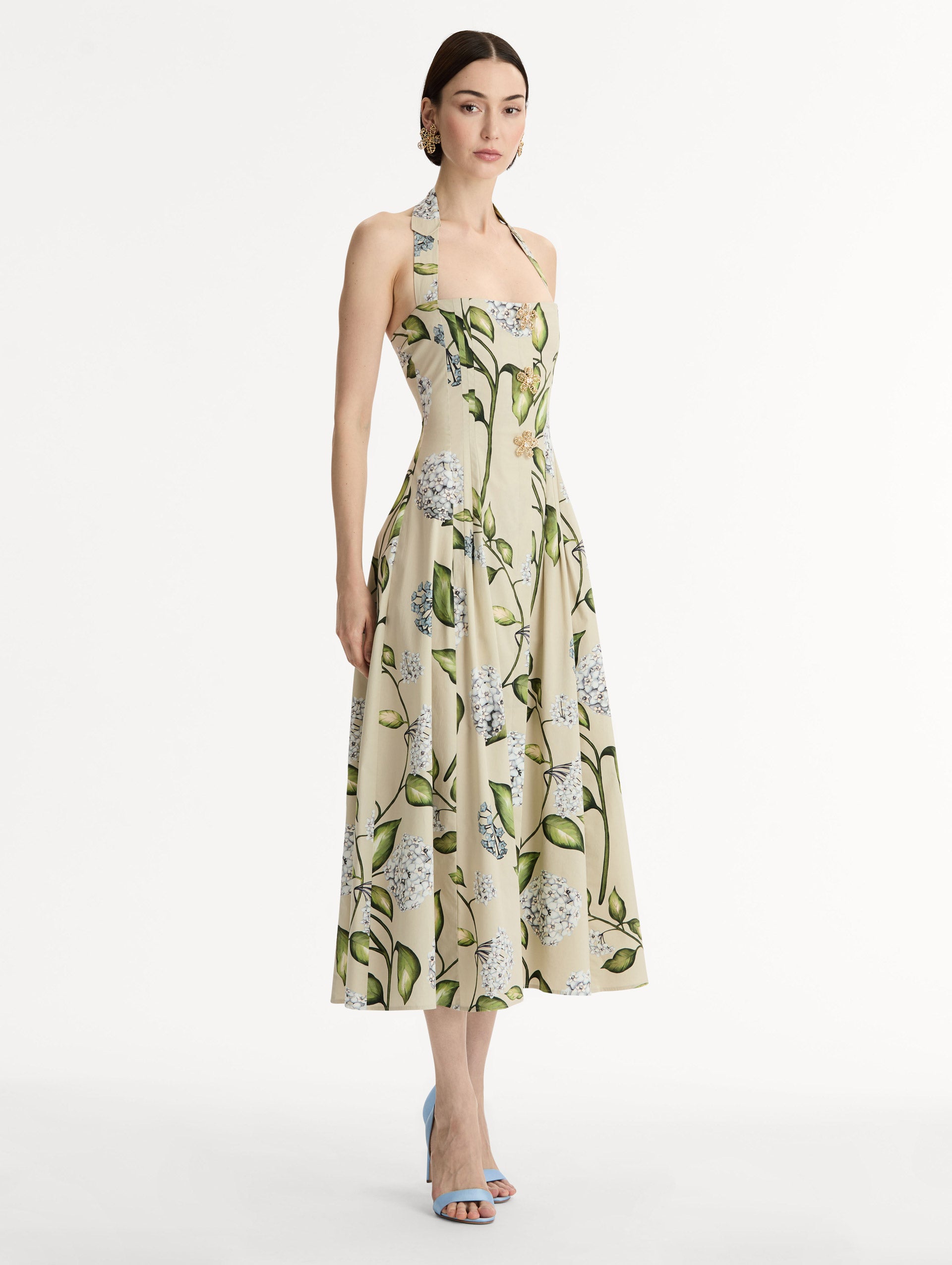 Cotton Poplin Halter Neck Midi Dress. Three Gold Floral Buttons at Front. Blue and Green Florals. Side View.