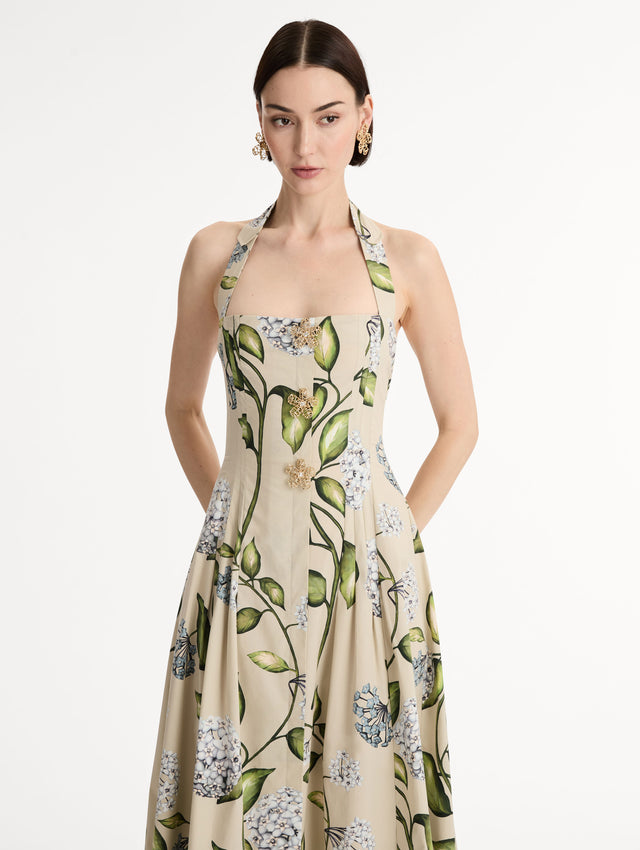 Cotton Poplin Halter Neck Midi Dress. Three Gold Floral Buttons at Front. Blue and Green Florals. Front View, Close Up.