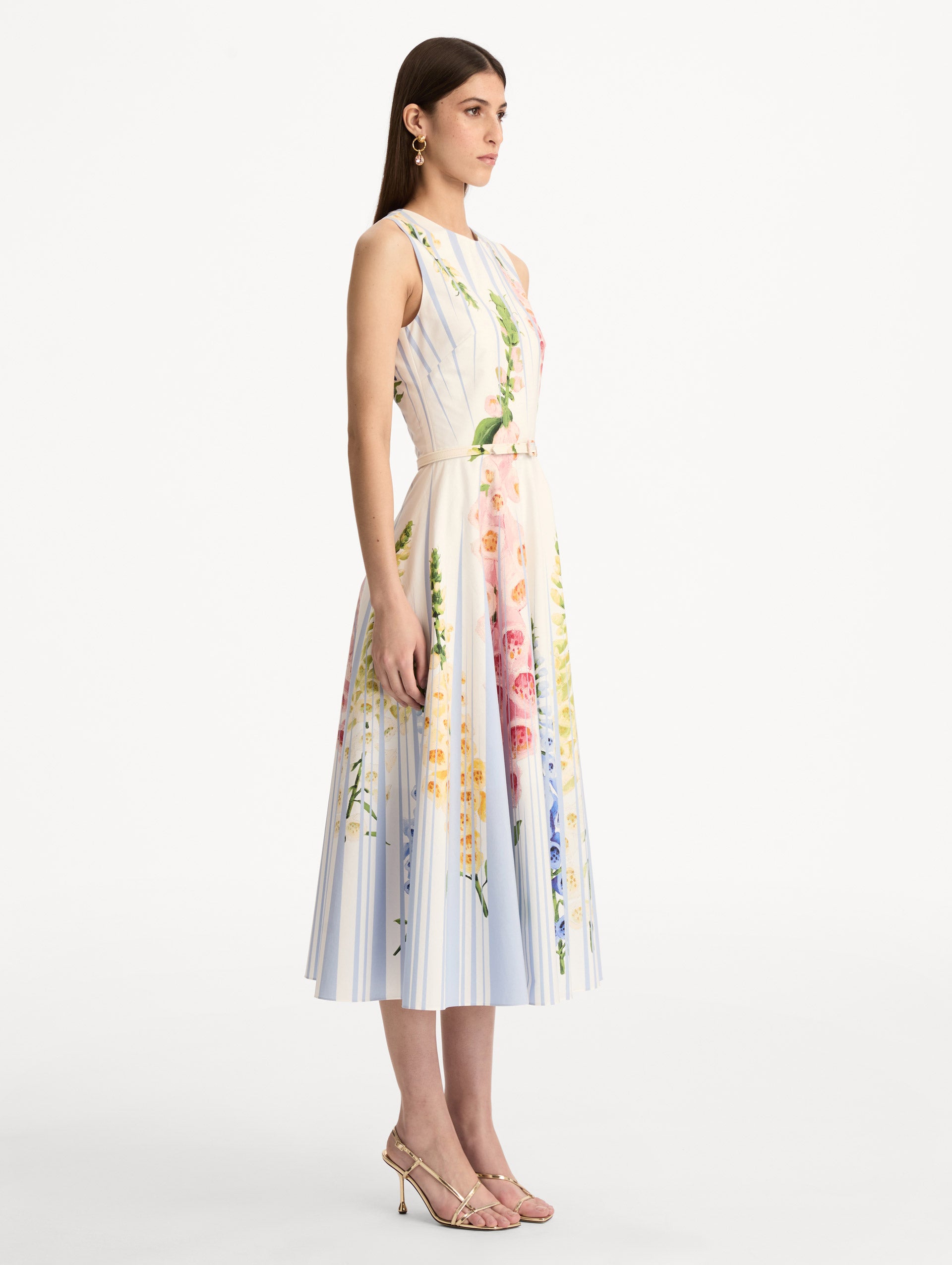 White and Blue Foxglove Trompe L’oeil Cotton Poplin Dress with belted waist and printed foxglove motifs. Side View.