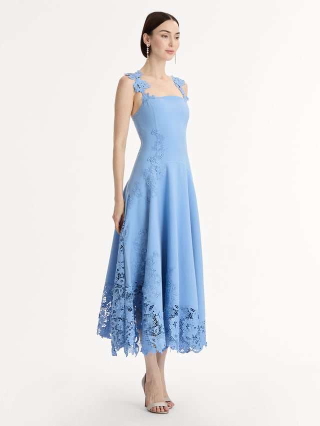 Blue Midi Dress, Fitted Bodice, Pleated Skirt, Flower Guipure straps and hem. Side View.