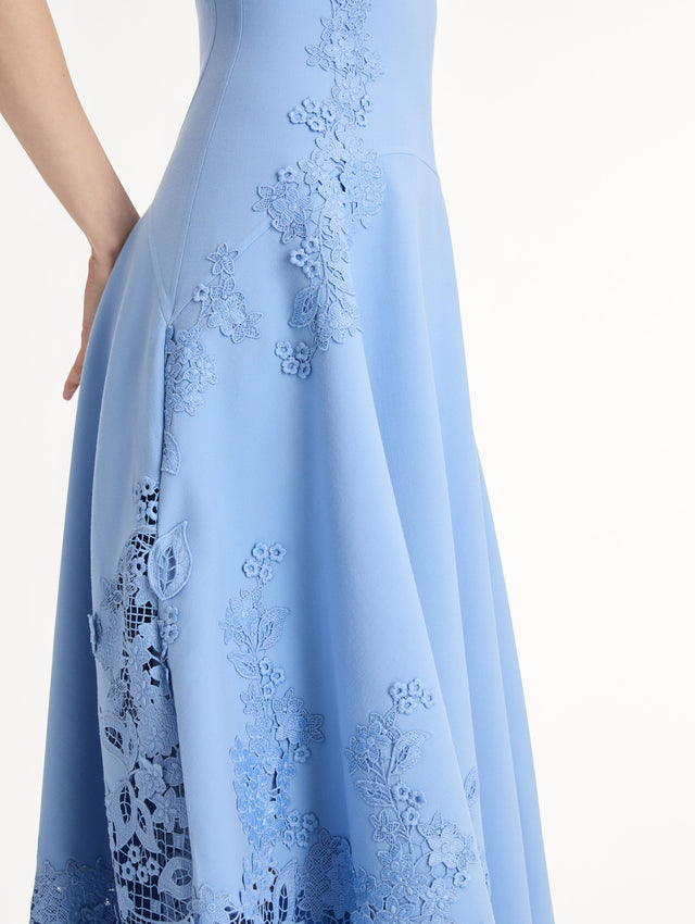 Blue Midi Dress, Fitted Bodice, Pleated Skirt, Flower Guipure straps and hem. Side View, Close Up.