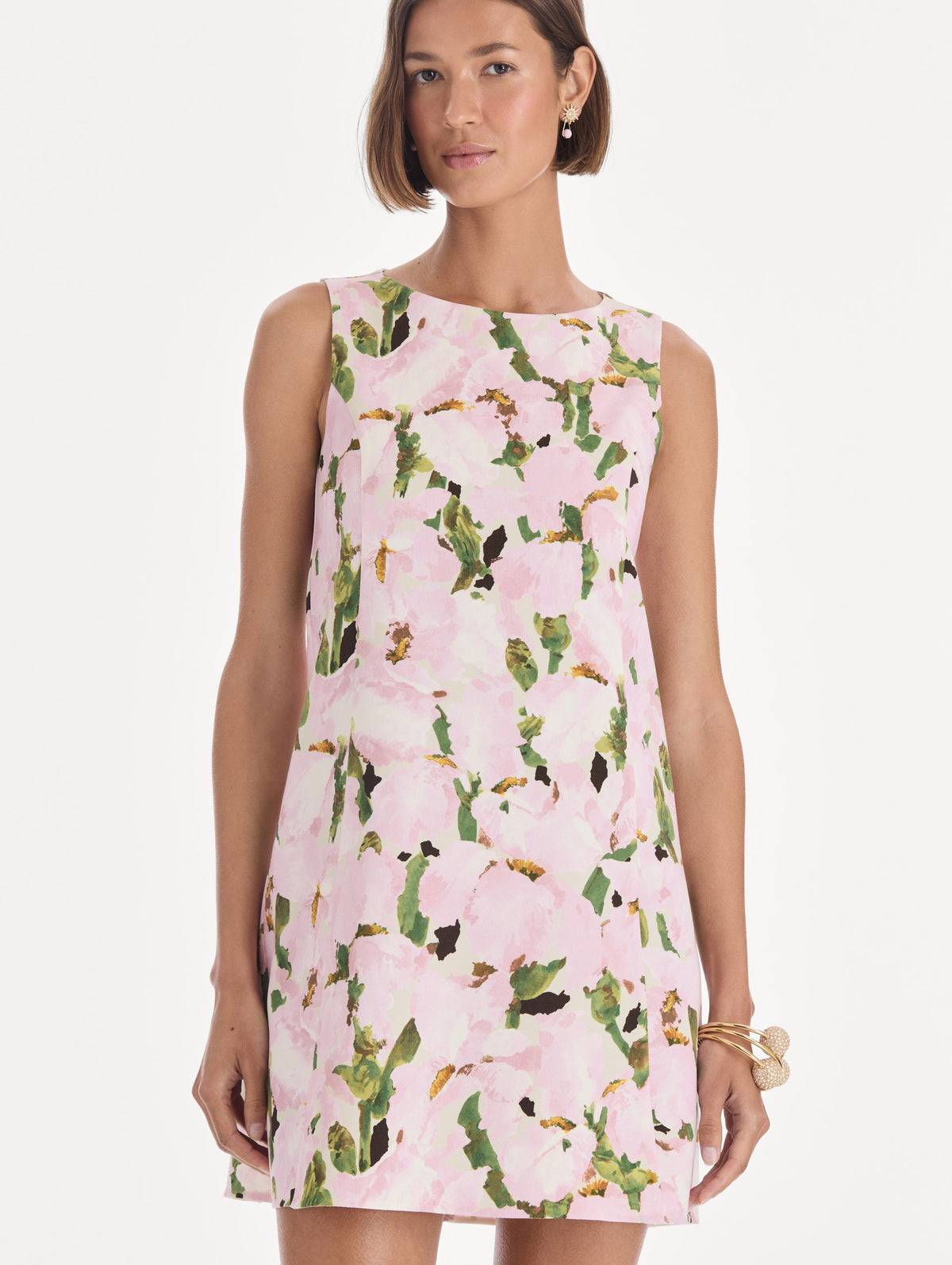 The model is wearing a sleeveless watercolor iris wool shift dress. Zoom view.