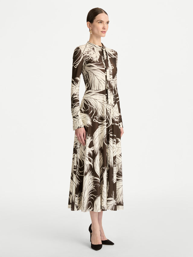 Brown and Ivory Feather Jersey Dress with long sleeves and neck tie. Side View.