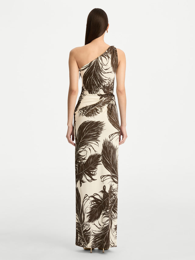Ivory and Black Feather Jersey Maxi Dress with a one shoulder slim silhouette, featuring bold black feather print detailing. Back View.