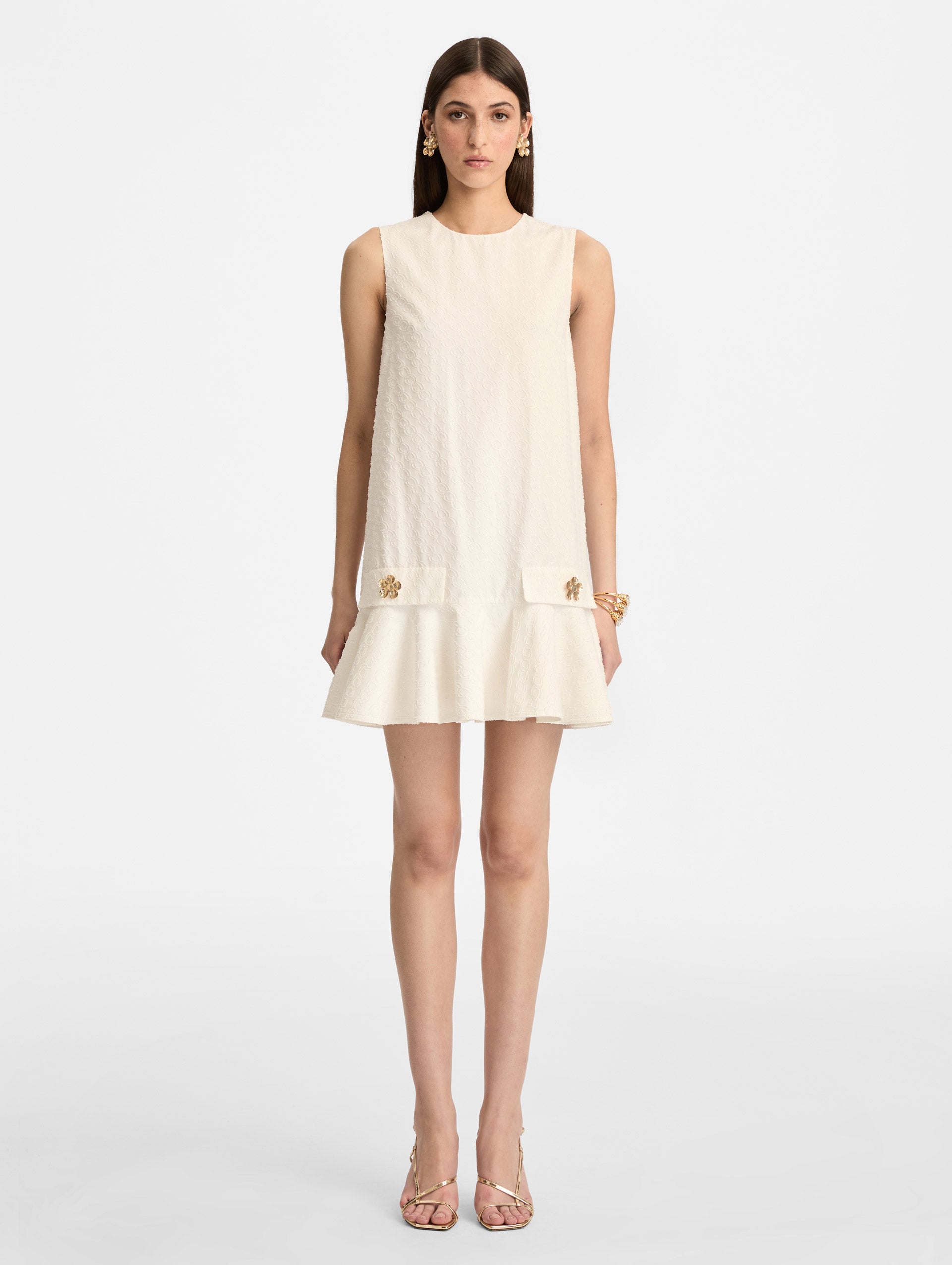 White Oscar Chain-Link Cotton Poplin Dress with drop waist, flared hem, and gold floral button accents on front pockets. Front View.