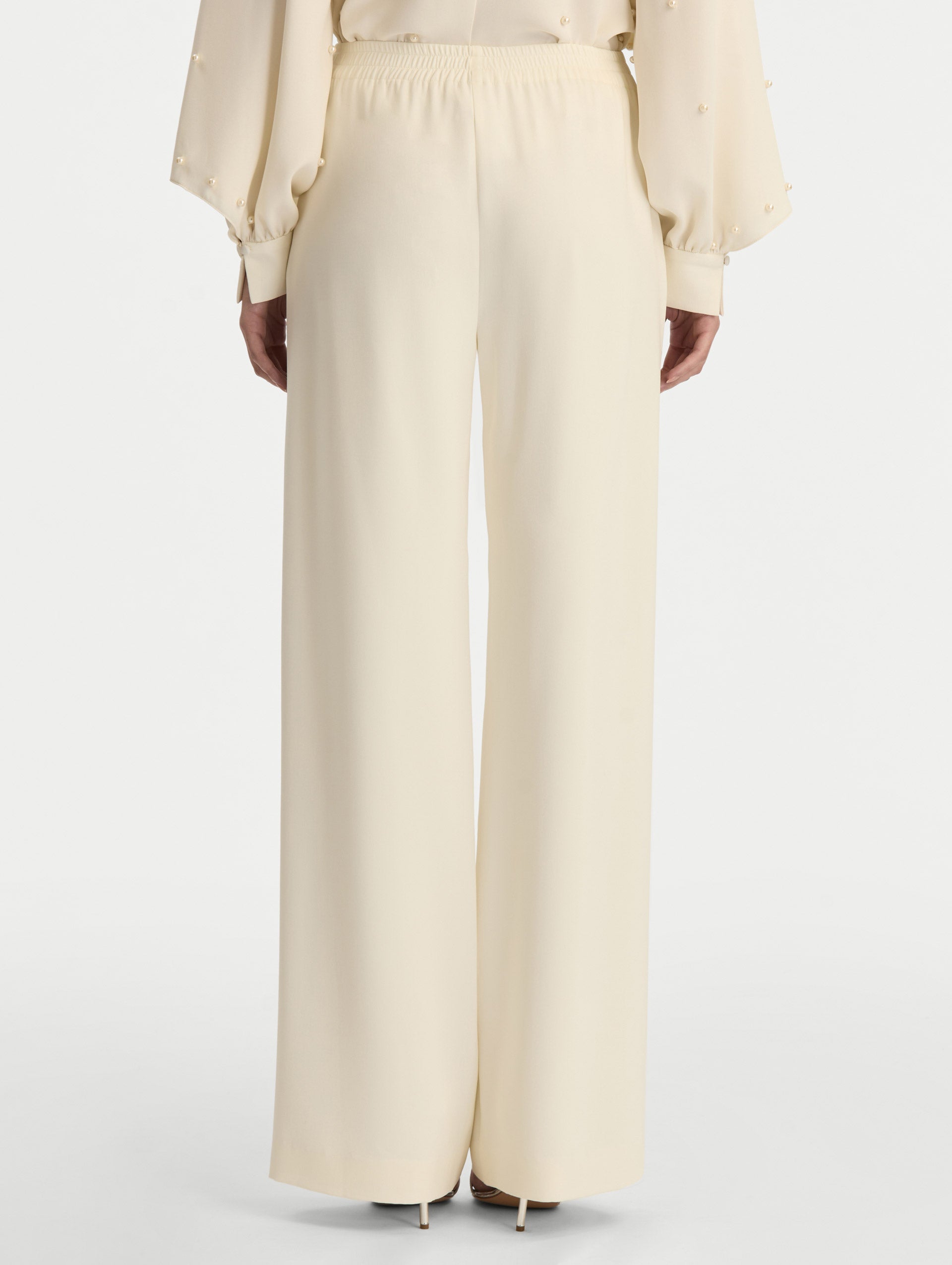 Ivory Silk Georgette Wide Leg Pant with an elastic waistband. Back View.