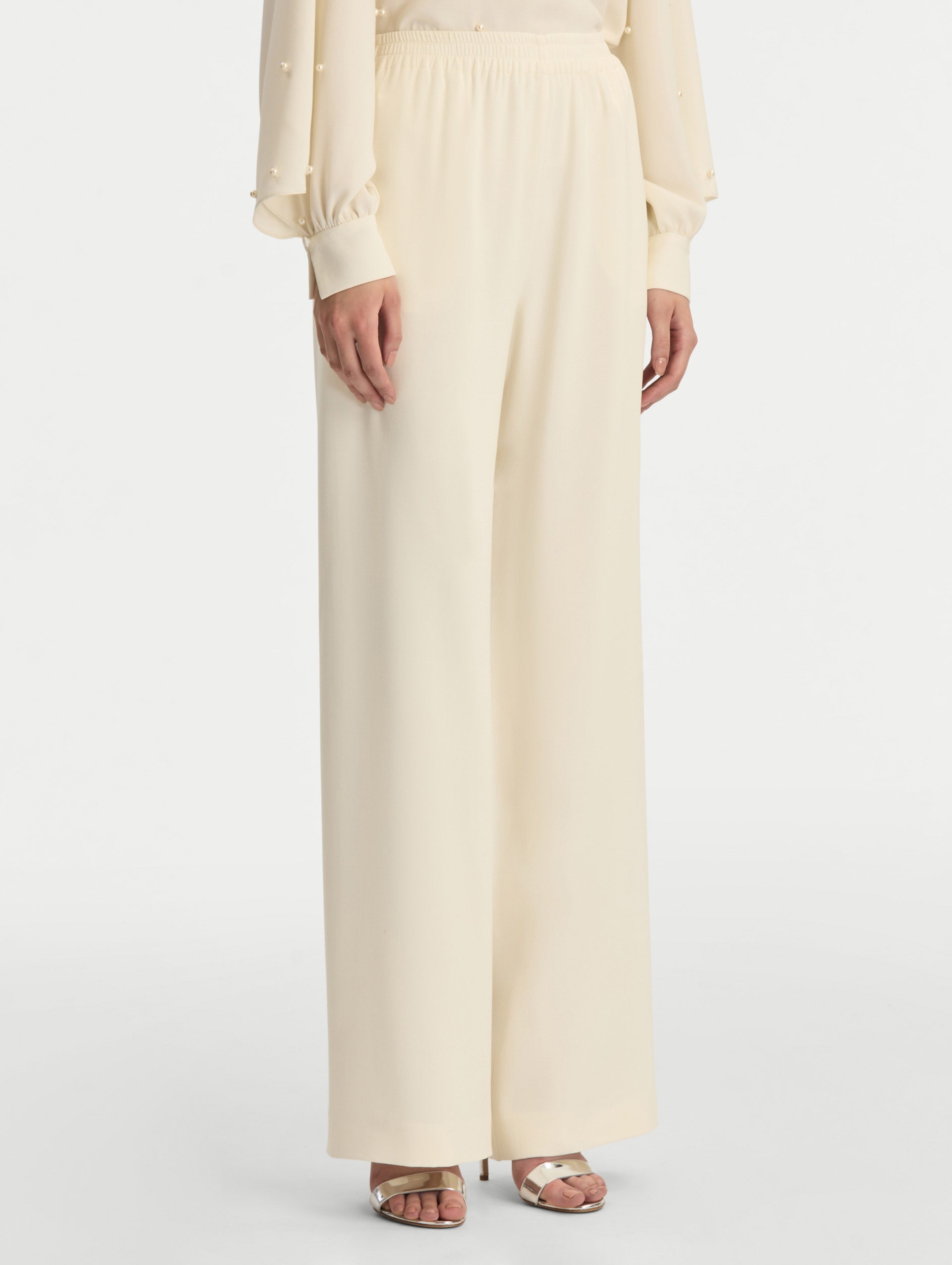 Ivory Silk Georgette Wide Leg Pant with an elastic waistband. Side View.