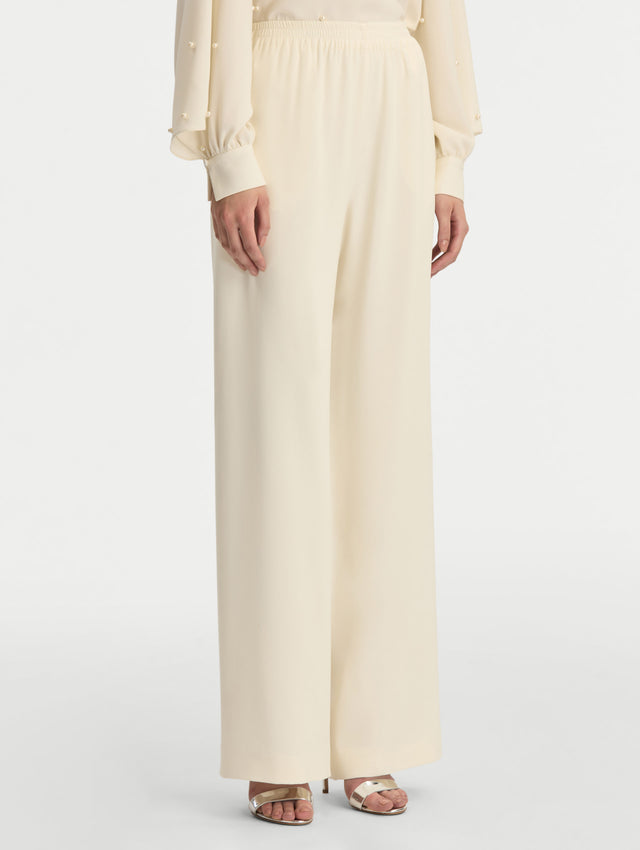Ivory Silk Georgette Wide Leg Pant with an elastic waistband. Side View.