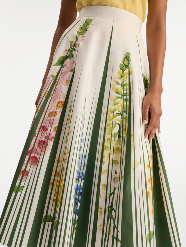 White Foxglove Trompe L’oeil Cotton Poplin Skirt with vertical green stripes and multicolor foxglove floral print. Zoom View.
