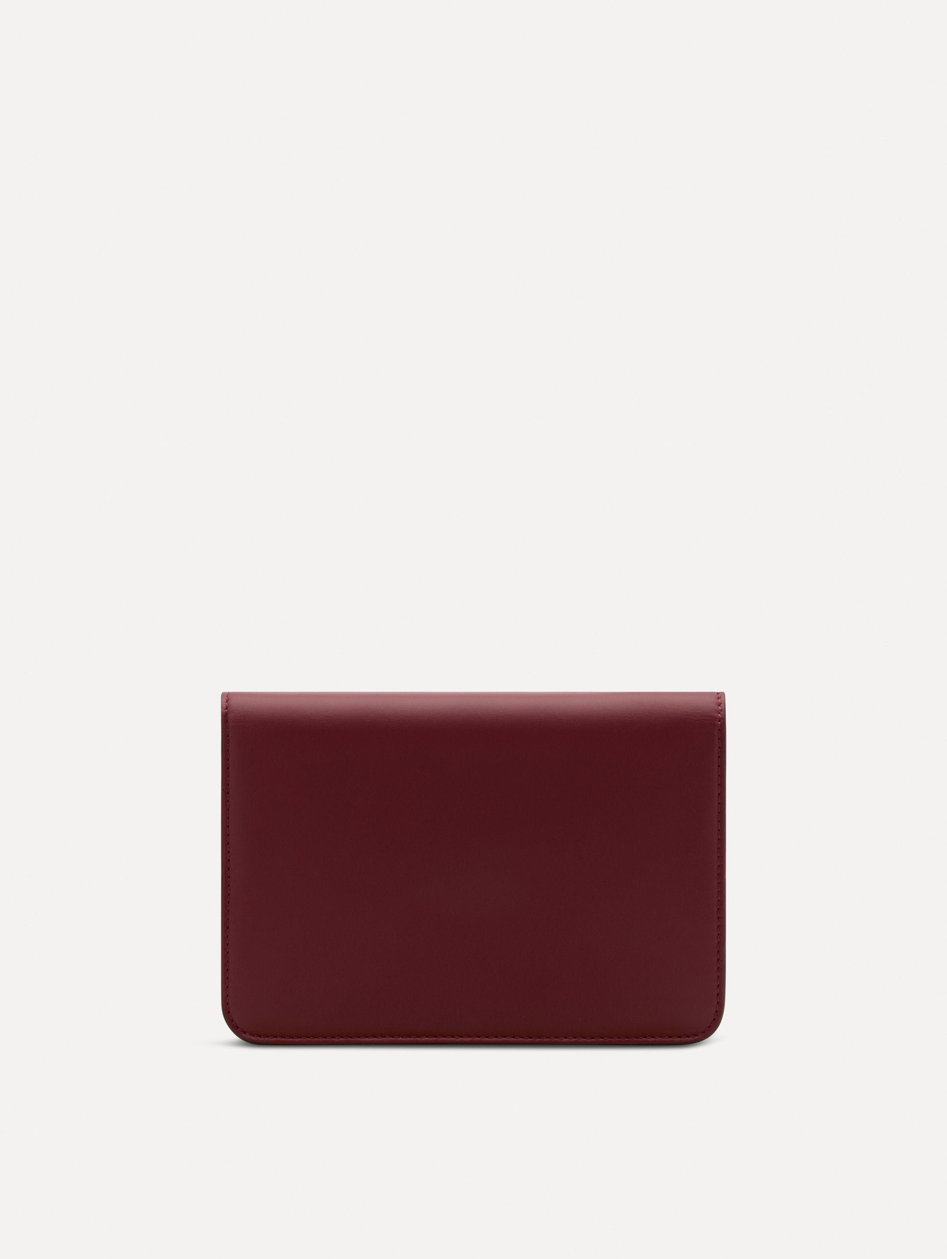 Maroon O Pochette with gold hardware and abstract O Clasp. Back View. 