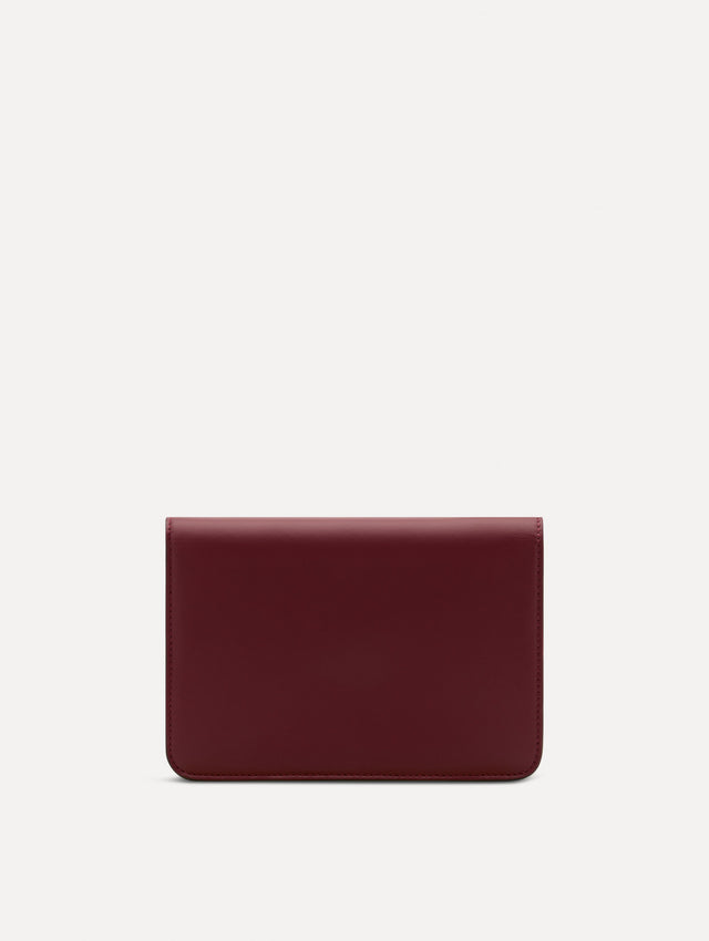 Maroon O Pochette with gold hardware and abstract O Clasp. Back View. 