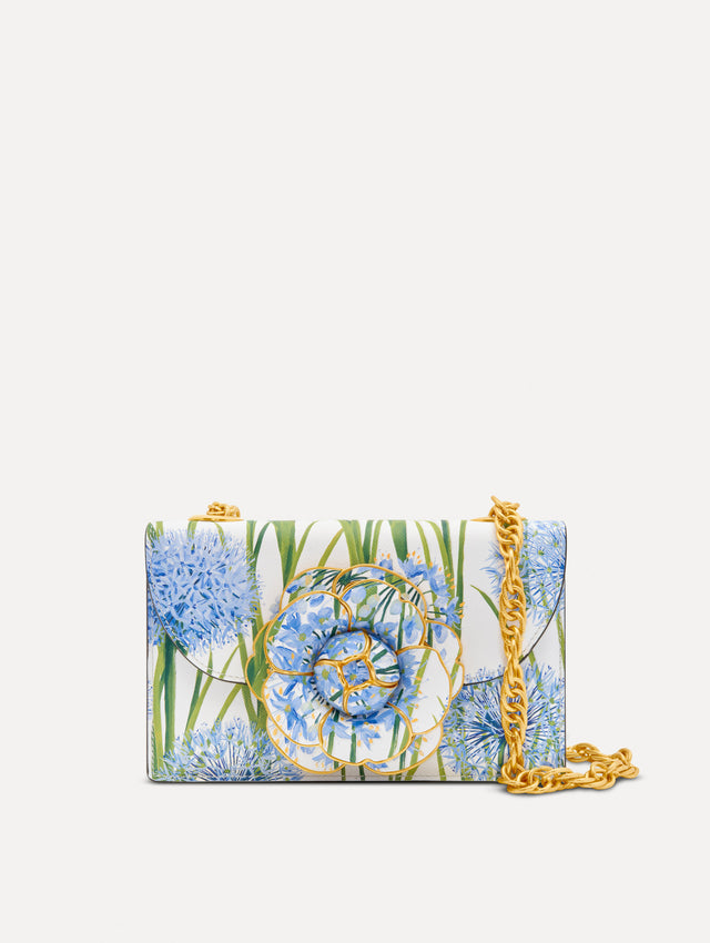 White, blue and green Allium Printed TRO Bag with gold hardware and flower embellishment. Front View.