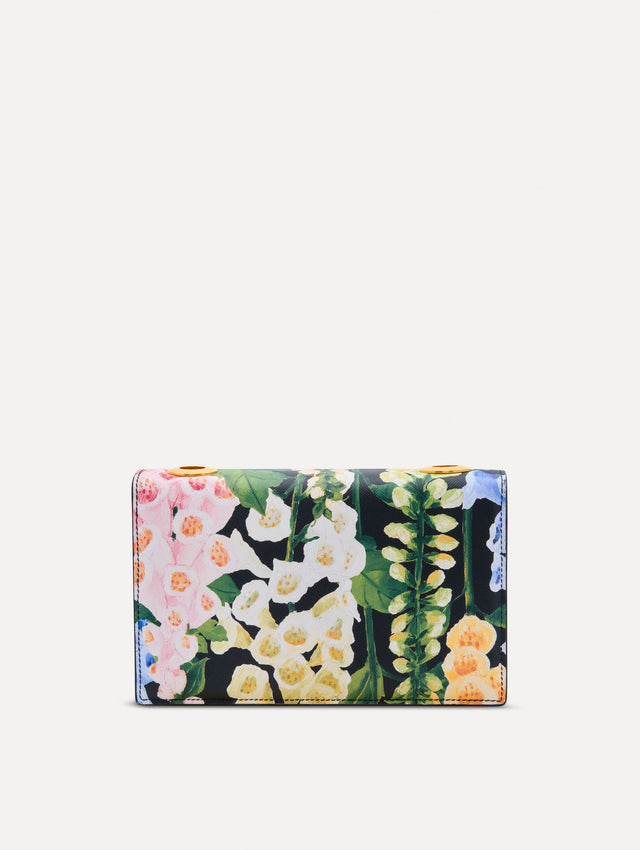 Floral Foxglove Printed TRO Bag with gold Hardware and Flower detail. Back View.