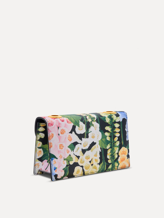 Floral Foxglove Printed TRO Bag with gold Hardware and Flower detail. Back View.