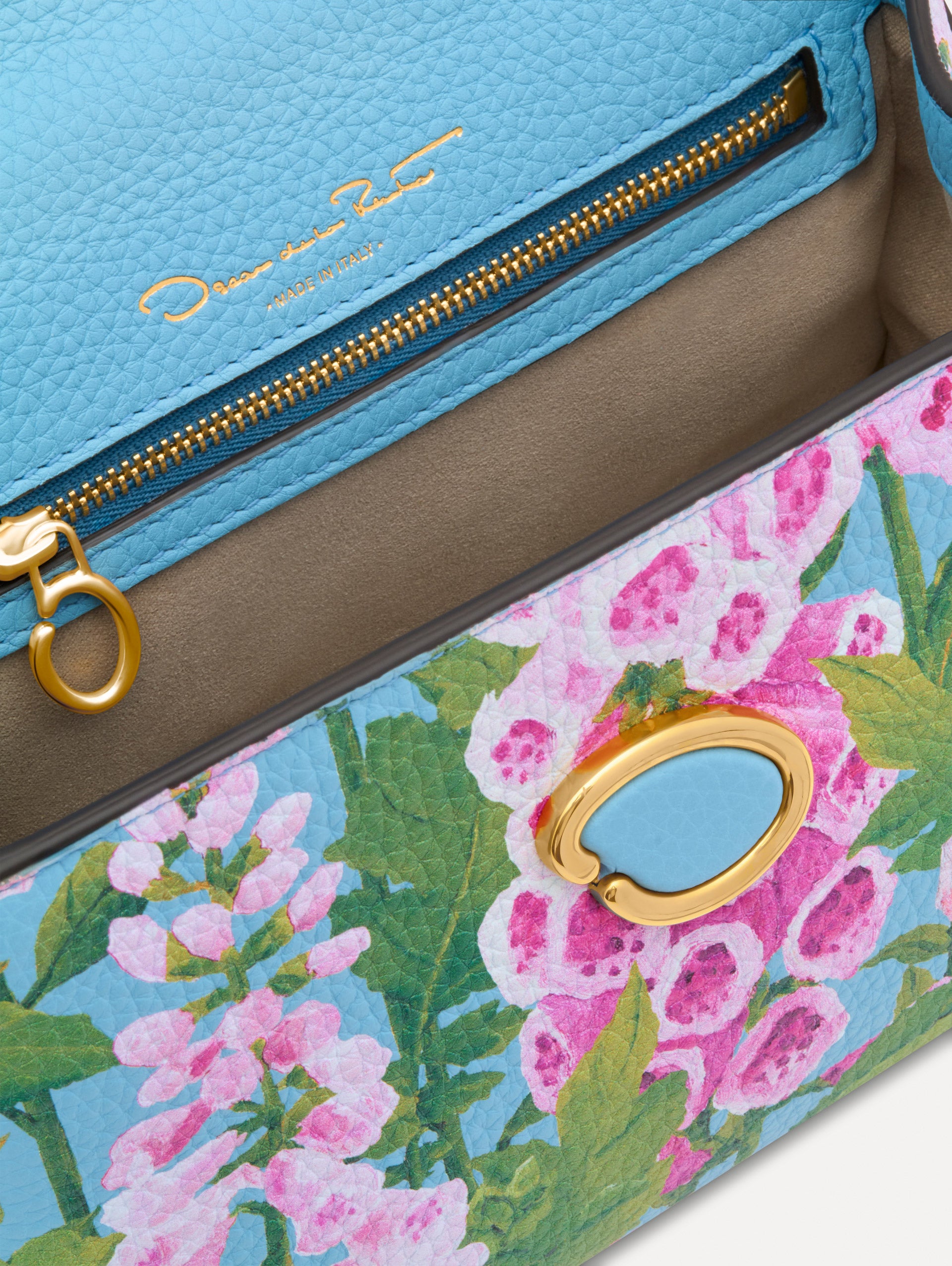 Blue, green, and pink Foxlove printed Mini Poppy with gold hardware. Zoom View.