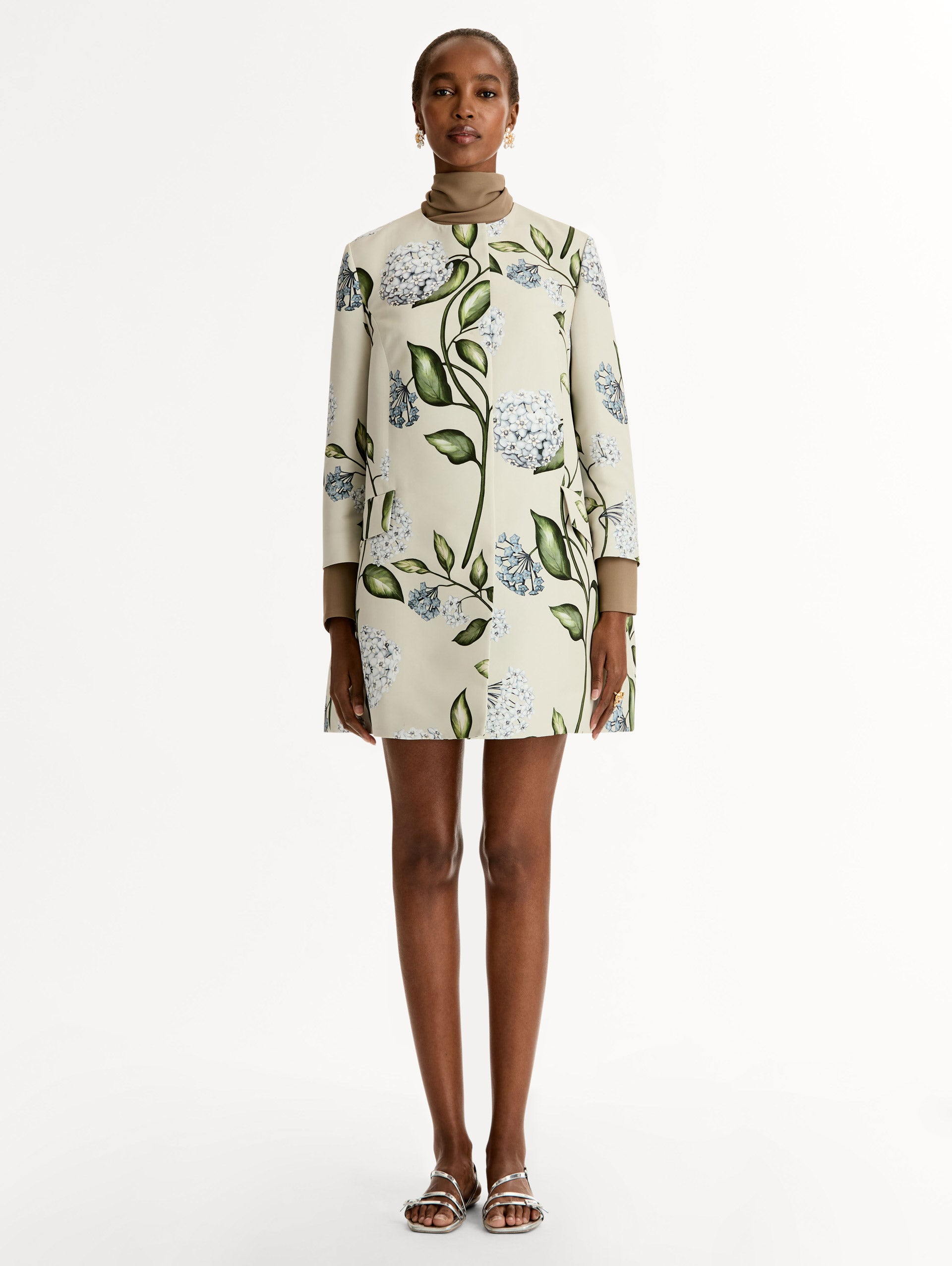 Floral Porcelain Flower Faille Coat in ivory, blue and green. Button closure with long sleeves. Front View. 