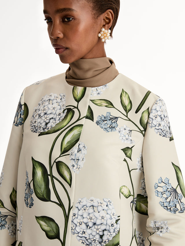 Floral Porcelain Flower Faille Coat in ivory, blue and green. Button closure with long sleeves. Close Up View. 