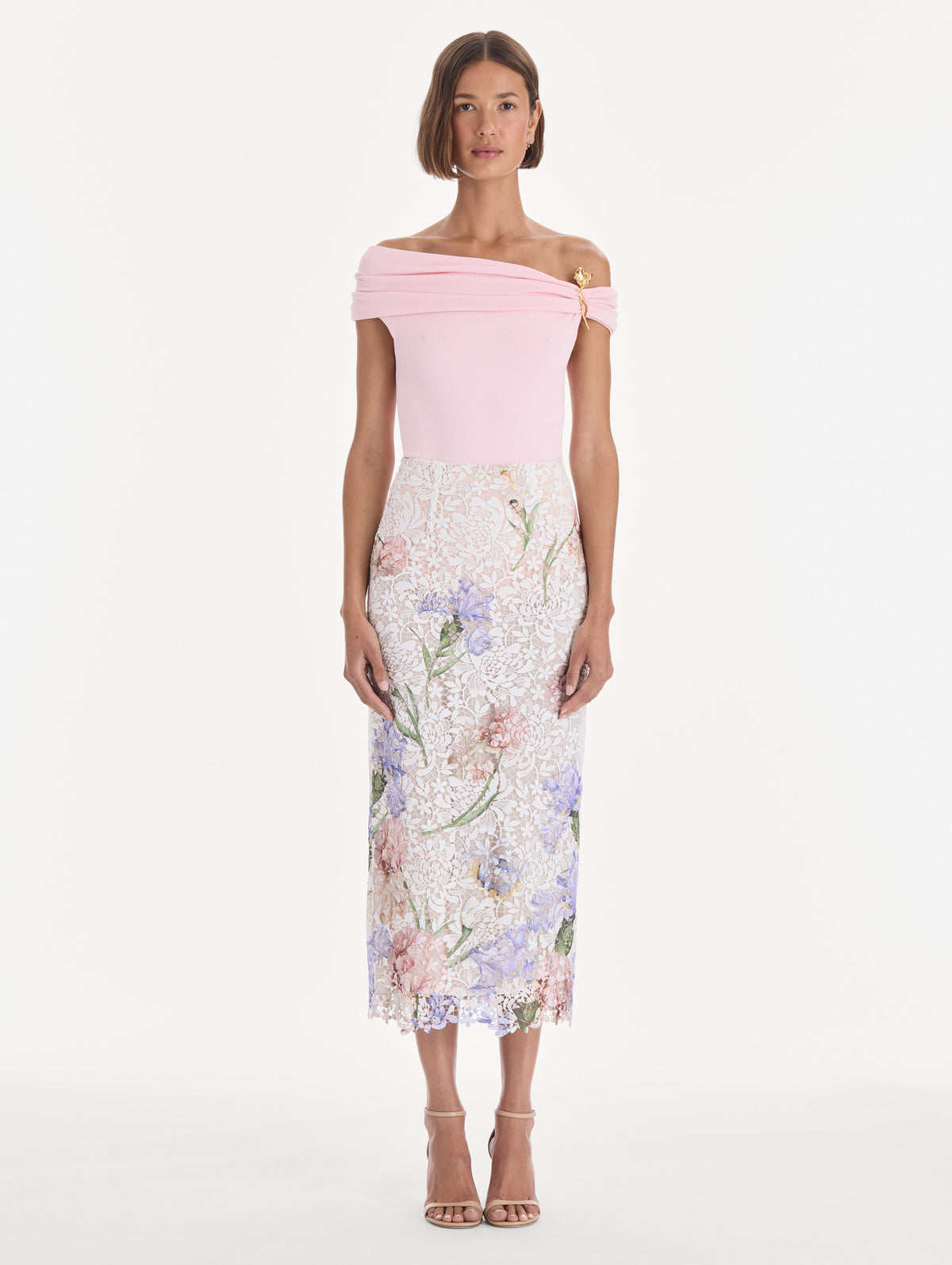 The model is wearing a large iris degrade printed lace pencil skirt. Front view.