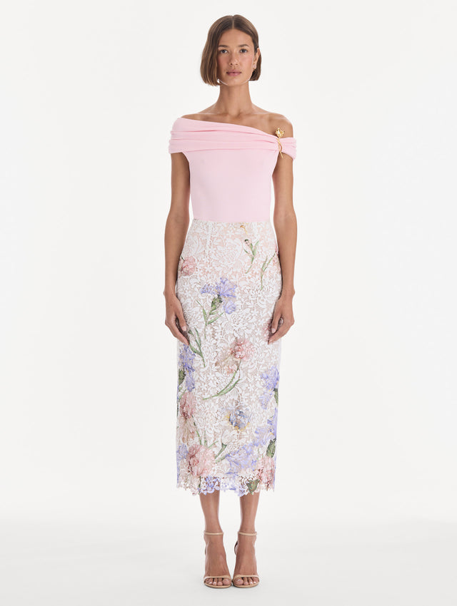 The model is wearing a large iris degrade printed lace pencil skirt. Front view.