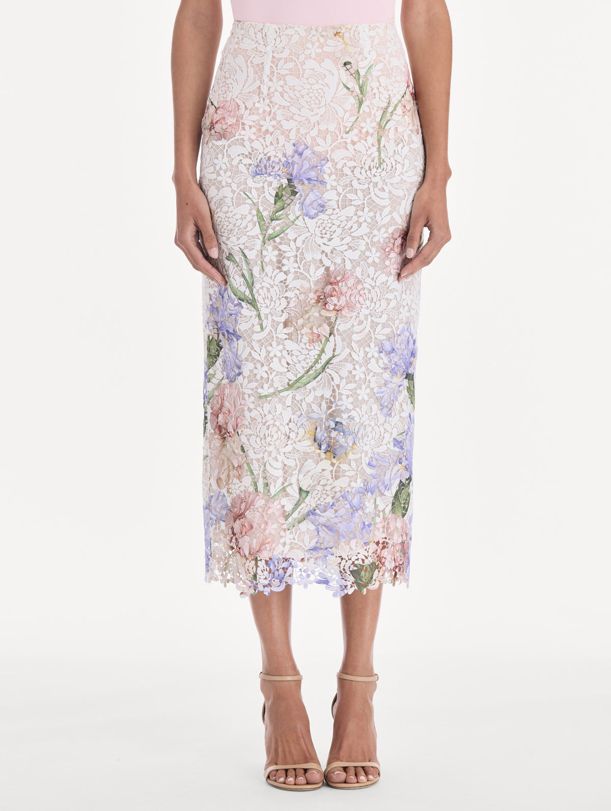 The model is wearing a large iris degrade printed lace pencil skirt. Side view.