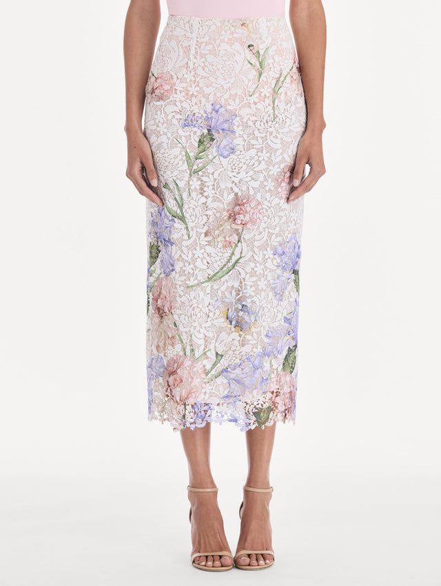 The model is wearing a large iris degrade printed lace pencil skirt. Side view.