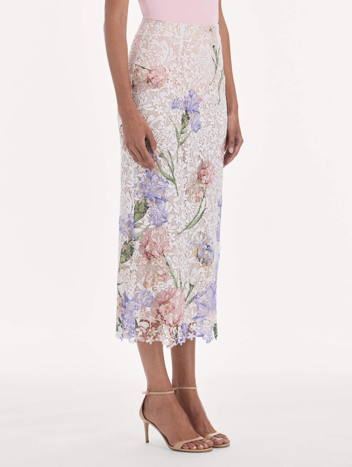 The model is wearing a large iris degrade printed lace pencil skirt. Zoom view.