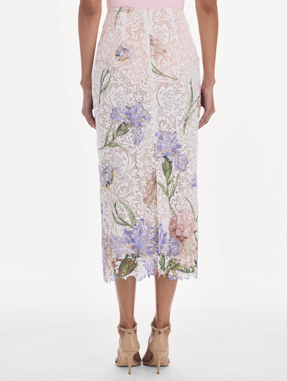 The model is wearing a large iris degrade printed lace pencil skirt. Back view.