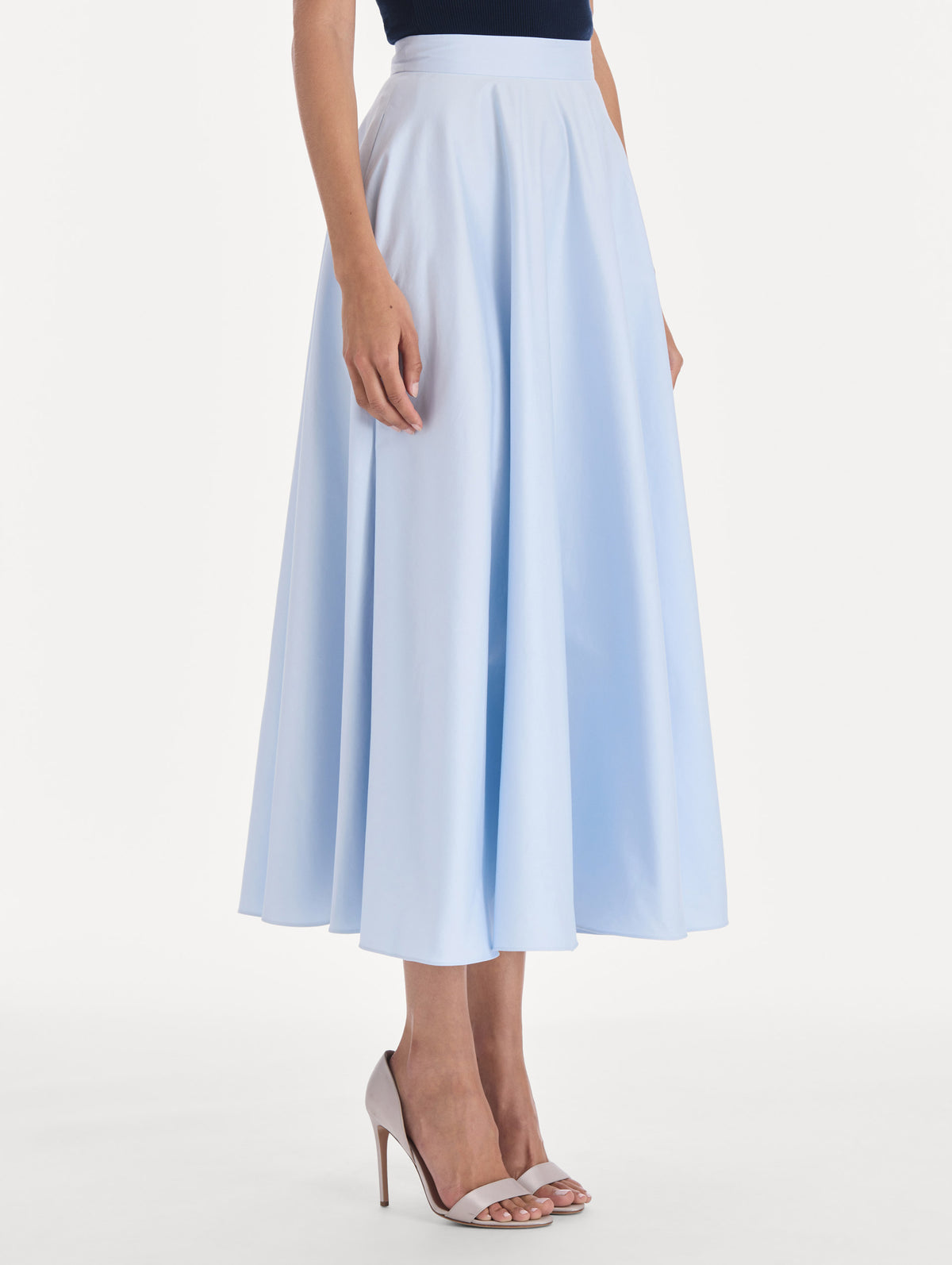 The model is wearing a cotton poplin sateen circle skirt. Zoom view.