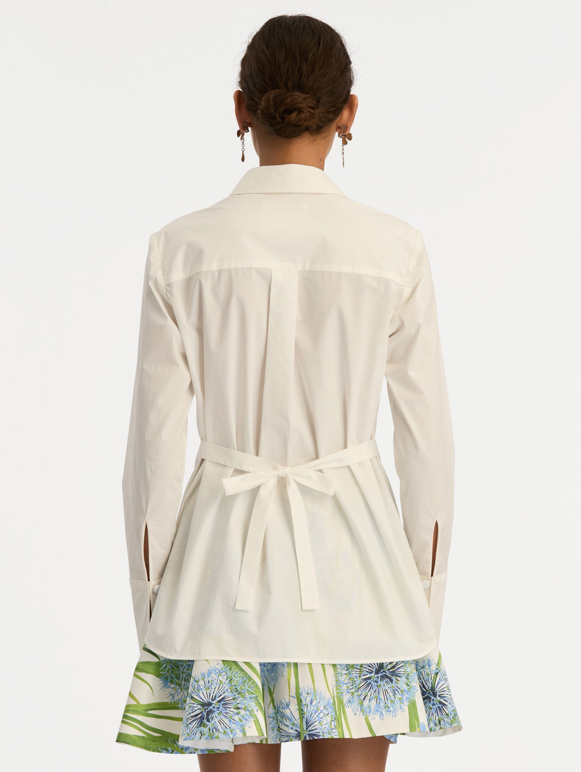 Ivory Allium Cotton Poplin Blouse with long sleeves and blue floral embroidery on the front. Back View.
