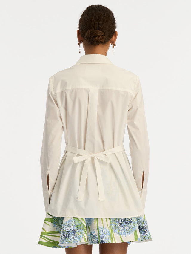 Ivory Allium Cotton Poplin Blouse with long sleeves and blue floral embroidery on the front. Back View.
