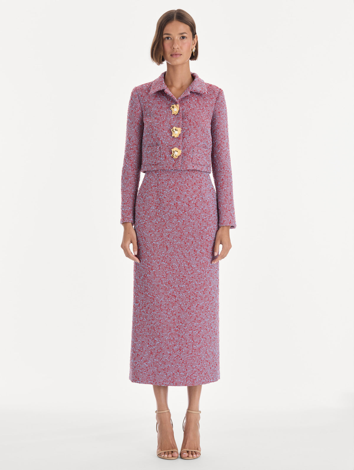 The model is wearing a long sleeve slubby wool tweed gauze jacket. Front view.
