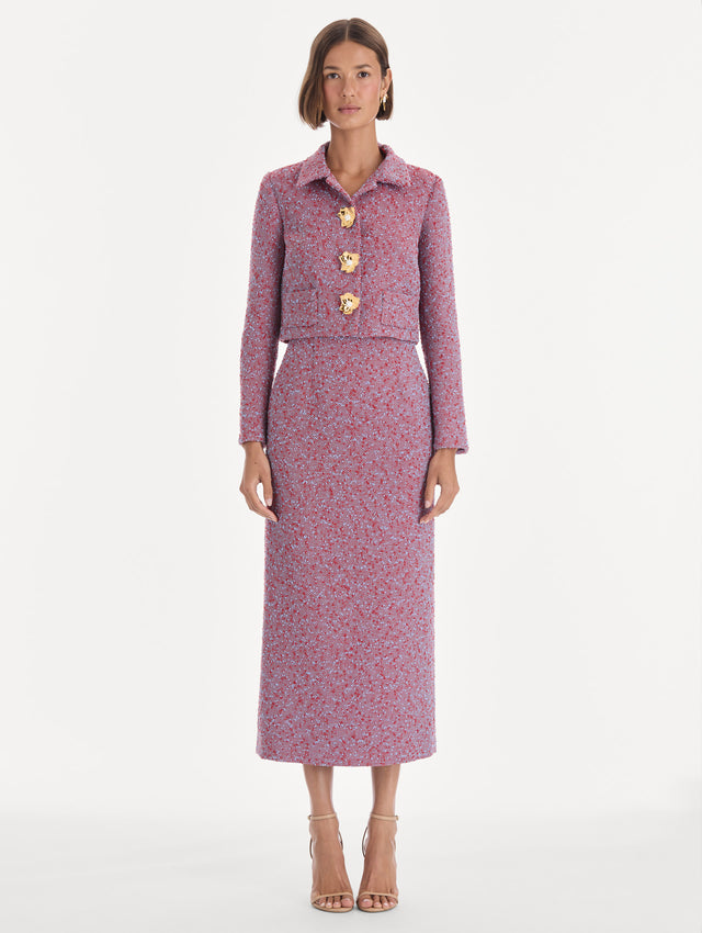 The model is wearing a long sleeve slubby wool tweed gauze jacket. Front view.