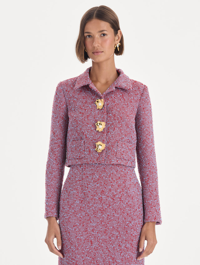 The model is wearing a long sleeve slubby wool tweed gauze jacket. Front view.