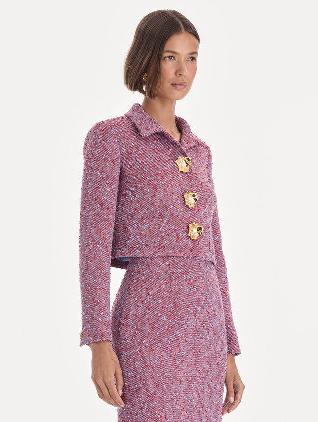The model is wearing a long sleeve slubby wool tweed gauze jacket. Side view.