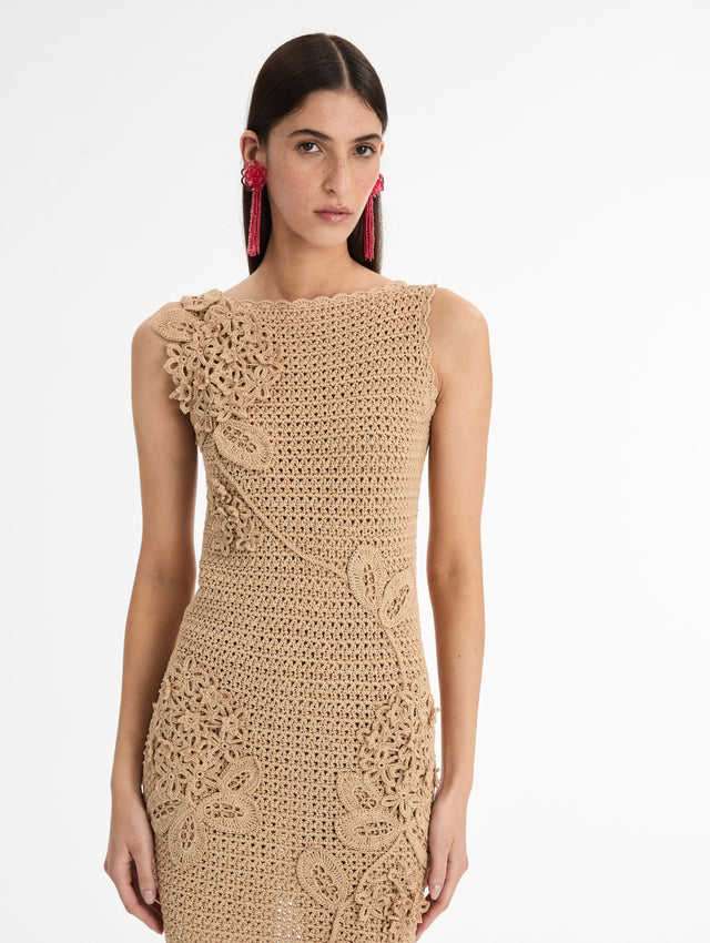 Taupe, halter neck mini dress with tonal porcelain flowers  across an intricate hand-crocheted lattice, sculpted petals winding along the body. Front View, Close Up. 