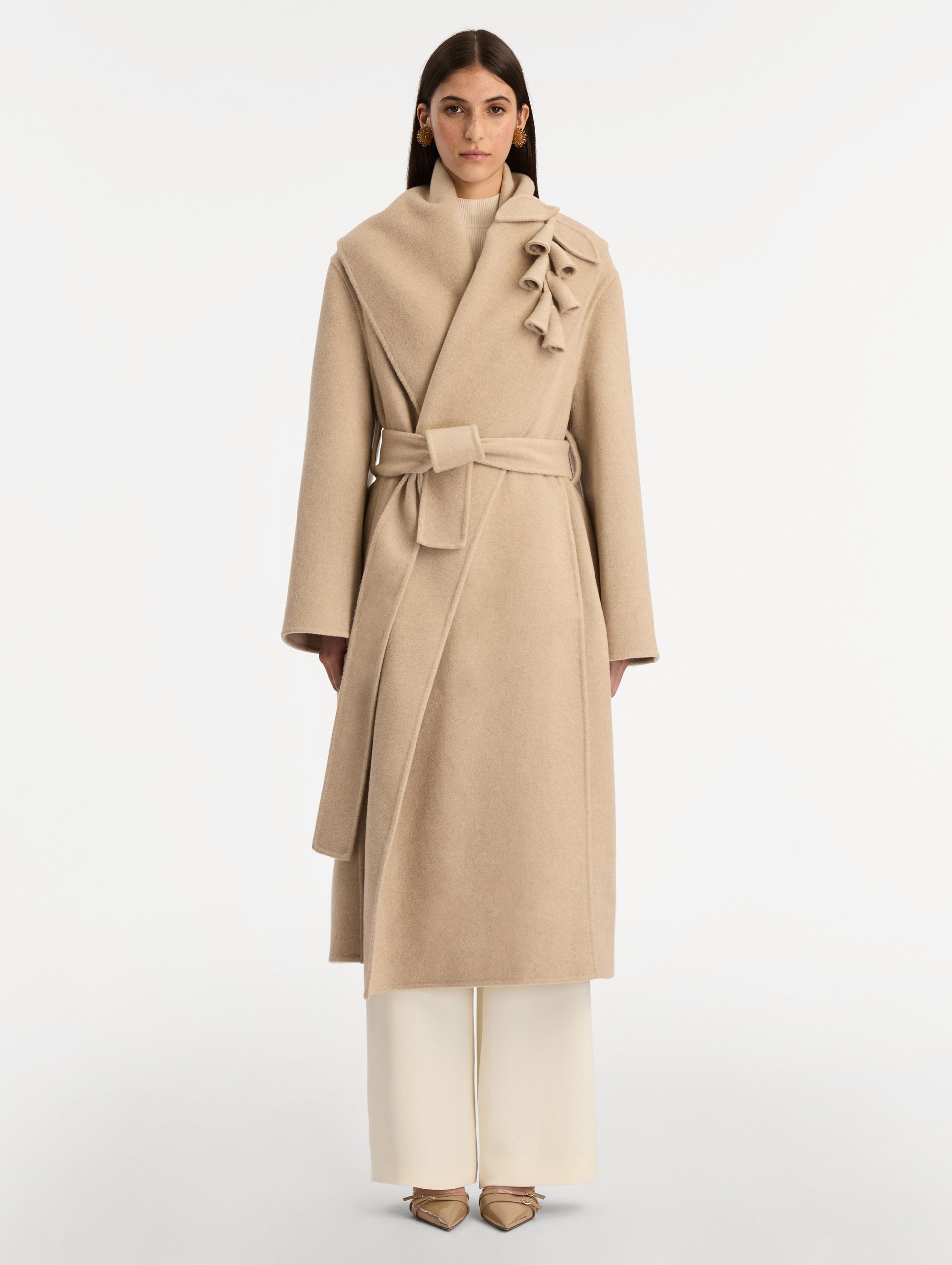 Beige Foxglove Embroidered Wool Coat with floral detail on the lapel and thick wool belt. Front View.