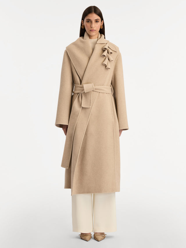 Beige Foxglove Embroidered Wool Coat with floral detail on the lapel and thick wool belt. Front View.