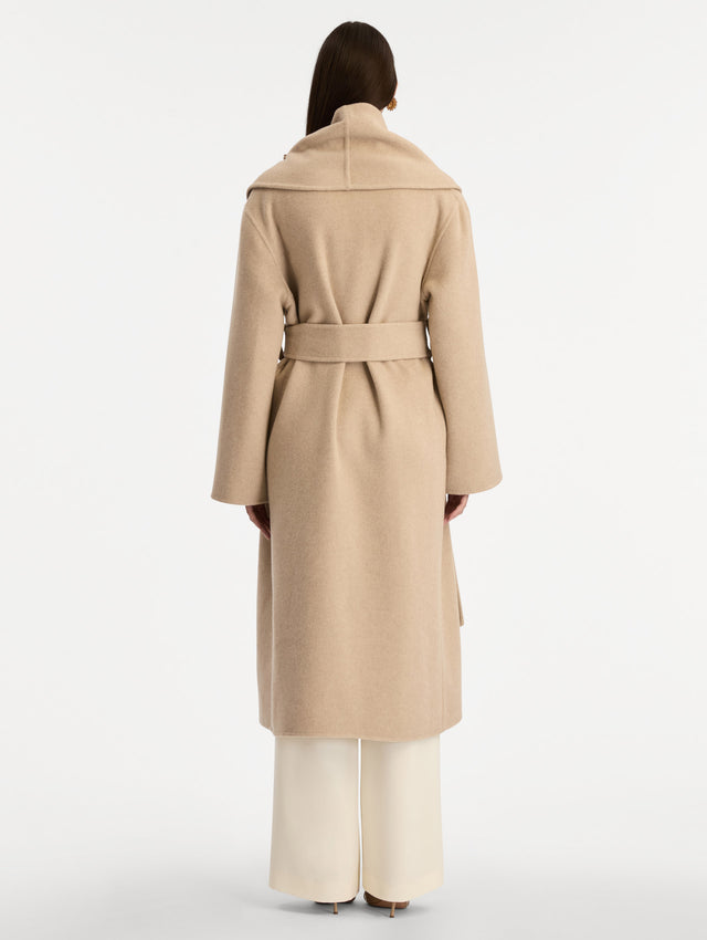 Beige Foxglove Embroidered Wool Coat with floral detail on the lapel and thick wool belt. Back View.