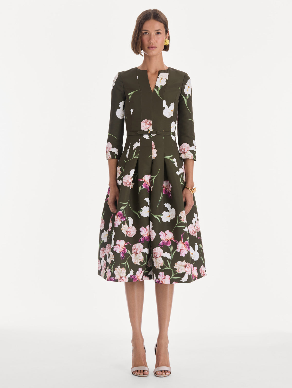 The model is wearing a long sleeve painted iris degrade faille cocktail dress. Front view.