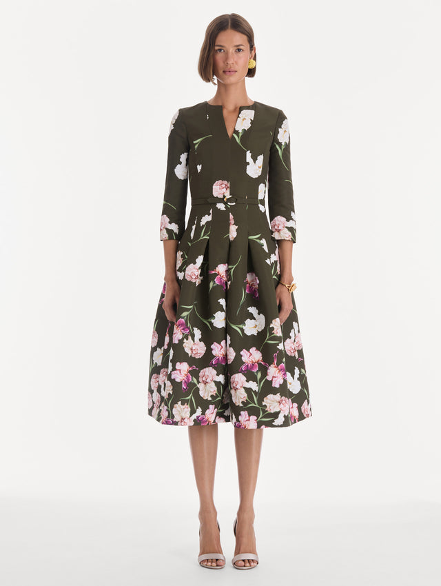 The model is wearing a long sleeve painted iris degrade faille cocktail dress. Front view.