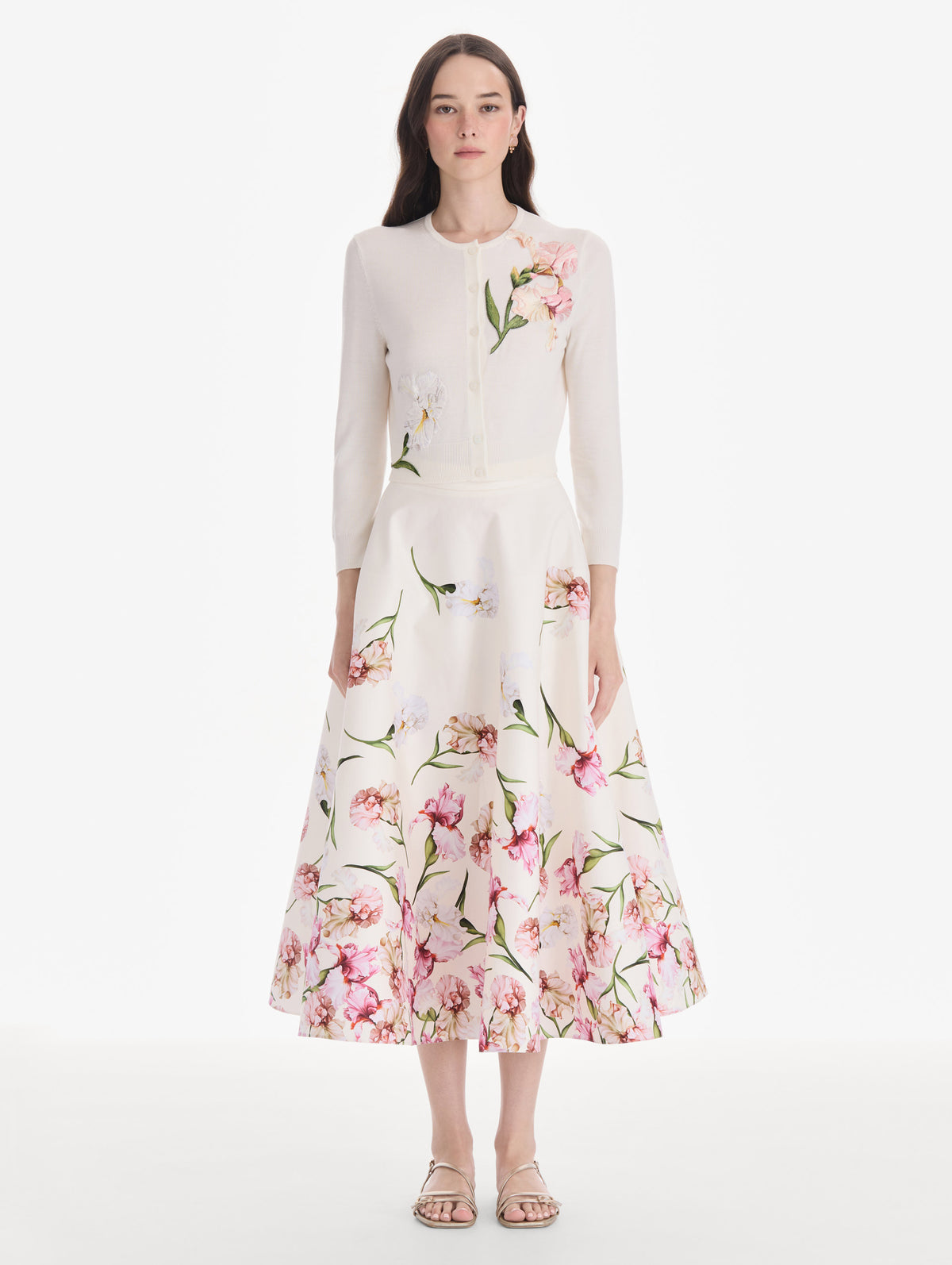 The model is wearing an embroidered cardigan. Front view.